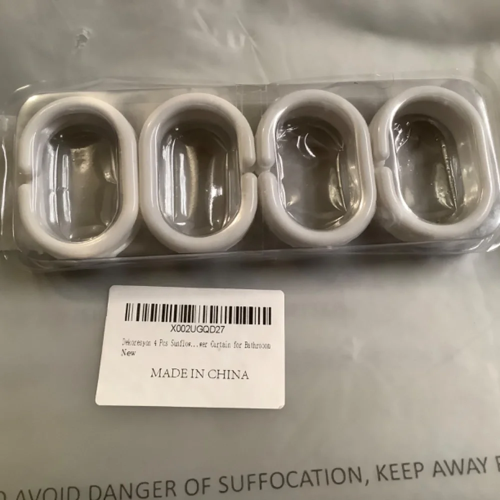 New in package Sunflower shower set,  4 pc set plus shower hooks.